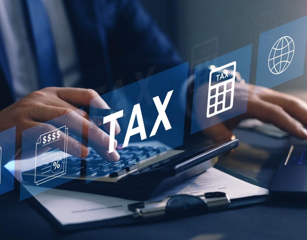 Businessman,Using,The,Laptop,To,Fill,In,The,Income,Tax